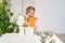 kid girl prepares dough in submersible mixer and it tastes unpalatable