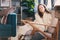 Kid girl relaxing in cozy chair at home