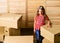 Kid girl relocating boxes background. Relocating concept. Delivery service. Box package and storage. Small child prepare