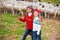 Kid girl shepherdess sisters happy with flock of sheep and stick