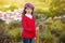 Kid girl shepherdess with wooden baston in Spain village