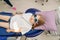 a kid girl sits in a chair in a dental office. regular preventive visits