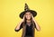 kid goes to wizard school. witchcraft and enchantment. childhood autumn holiday. girl ready to celebrate. costume party