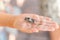 kid hand holding cicada cicadidae a black large flying chirping insect or bug or beetle on arm. child researcher exploring animals