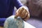 Kid hand putting one pound coin into piggy bank to donate money helping the earth, Hand holding money, Children learning to save