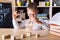 Kid hands playing building pyramid of cubes, child studying construction in classroom