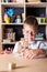 Kid hands playing building pyramid of cubes, child studying construction in classroom