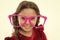 Kid happy wear cute eyeglasses accessory. Child charming smile isolated white background. Girl wear big funny eyeglasses