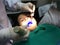Kid having mouth checkup in dental clinic