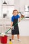 Kid helping with housework, cleaning. Portrait of child helping with housework, cleaning the house. Housekeeping, home
