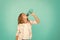 Kid hold bottle blue background. Water balance concept. Healthy and hydrated. Pediatric disorders of water balance. Girl