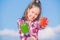 Kid hold ripe pepper harvest. Choose which. Kid girl hold red and green peppers sky background. Alternative decision