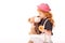 kid holding flower and kissing teddy bear