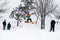 Kid jumping over a hill made of snow with snowboard 