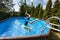 Kid jumping in swimming pool during staycation