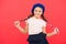 Kid little cute fashion girl posing with long braids and hat red background. Fashion girl. Fashionable beret accessory