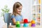 Kid little girl playing with toys indoors