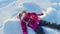 Kid making snow angel. Beautiful girl playing in snow