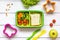 Kid menu lunchbox for school top view on wooden background