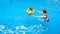 Kid and mother in aqua park. Little girl floating in pool with inflatable ring. Child at swimming lesson with mom