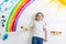 Kid painting rainbow