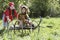 Kid In Pirate Costume Pushing Boy In Jaguar Costume On Cart