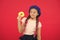Kid playful girl eat donut. Health and nutrition concept. Sweet life. Sweets shop and bakery concept. Kid fan of baked