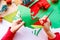 Kid playing with christmas crafts on white background. Christmas celebration. White background. Happy cheerful family. Home