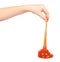 kid playing orange slime with hand, transparent toy