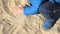 Kid playing with sand, Close up shot of his little hands