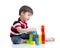 Kid playing toy blocks isolated