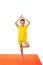 Kid practicing yoga isolated