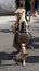 Kid with a prehispanic costume posing with shield