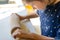 Kid preparing cookie dough with a rolling pin on a kitchen counter