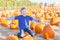 Kid at pumpkin patch