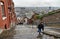 Kid on the rainy staircase in Liege