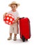 Kid with red ball and suitcase, ready for journey