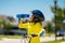 Kid riding bike in a helmet. Child riding bike in protective helmet. Safety kids sports and activity. Happy kid boy