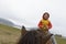 kid riding on horse alone