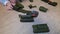 Kid rolls old military vehicles - metal cars colored in khaki