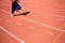 Kid runing on track in the Stadium