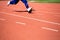 Kid runing on track in the Stadium