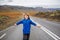 Kid running on an empty road in beautiful nature in Snaefellsjokull National Park in Iceland, autumntime