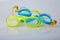 Kid`s and adult pool goggles on white background