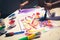 kid\\\'s drawing, painting with a brush and hands with color temperas on paper