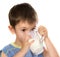 A kid\'s drinking some milk