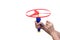 Kid`s hands holding and playing toy disc helicopter