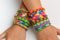 A kid\'s with rainbow color loom band