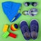 Kid\'s street outfit and some toys on white background.