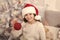 Kid in santa hat decorating christmas tree. Fancy decor. Creating festive atmosphere. Child decorating christmas tree